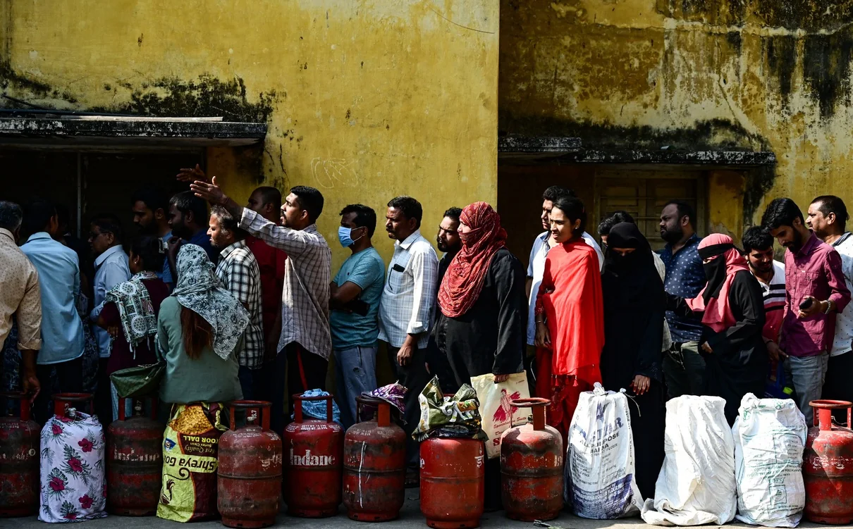 Residents queue with LPG cylinders outside a gas agency in Hyderabad.