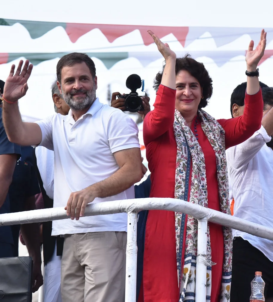 Rahul Gandhi and Priyanka Gandhi greet people during a campaign appearance in Medchal district.