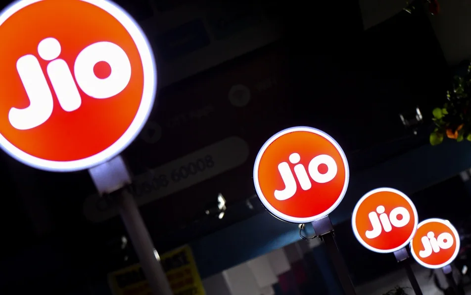 Jio logos appear on digital advertising boards at an office in Hyderabad.