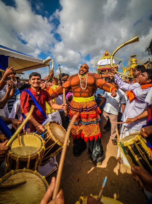 Musicians and artists perform during a religious procession in Udupi, Karnataka.